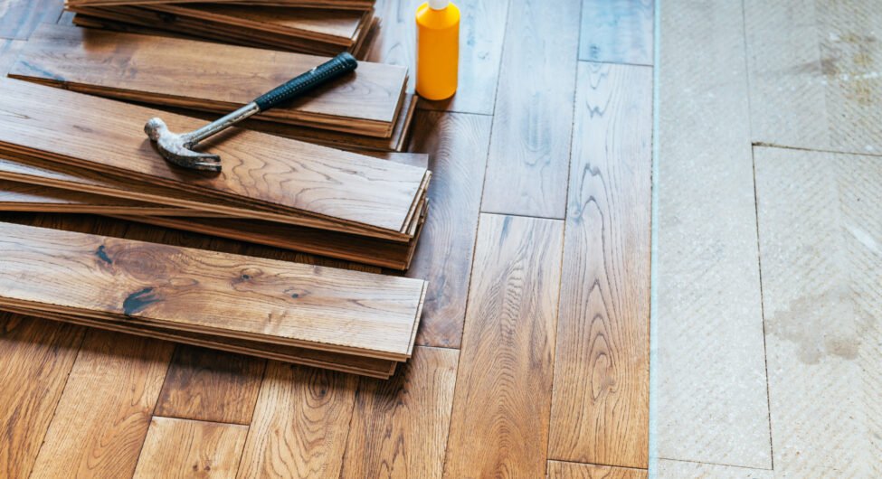 The process of house renovation with changing of the floor from carpets to solid oak wood. Beautiful golden handscraped oiled European oak brushed for added texture and fine definition of wood grain