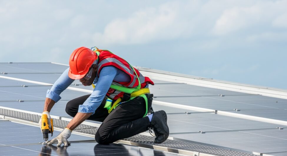 Engineer working setup Solar panel at the roof top. Engineer or worker work on solar panels or solar