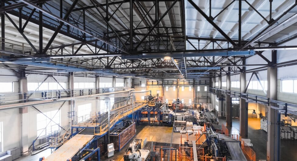 Fiberglass production industry equipment at manufacture background