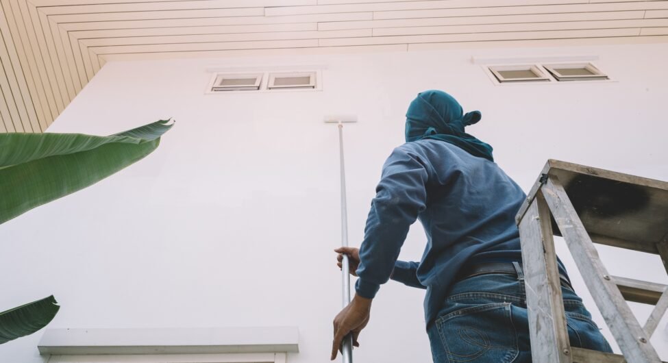 Man painting wall