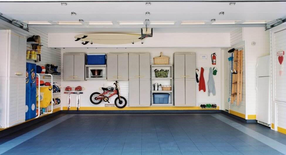 Surfboards and bicycles in empty garage